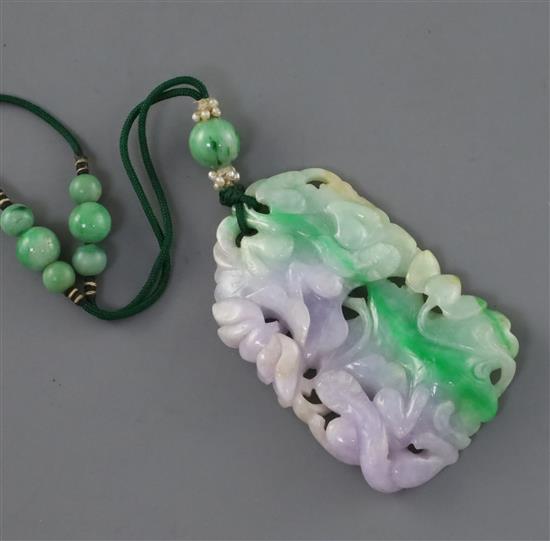 A Chinese jadeite pendant, first half 20th century, retailed by Liberty & Co., London, in a Liberty London & Paris fabric box